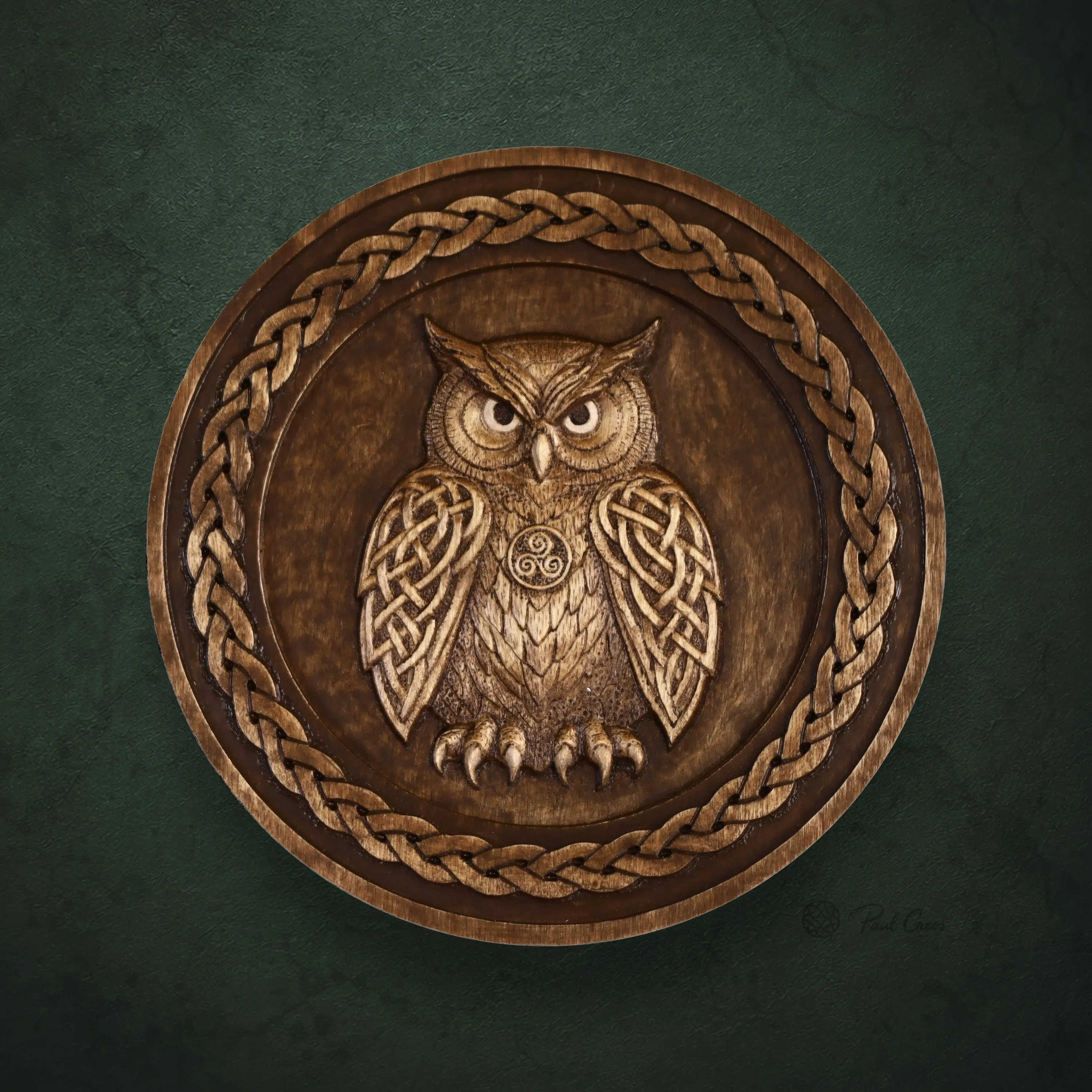 Front view of Owl Sentinel I, a circular wooden owl relief with Celtic-inspired knotwork