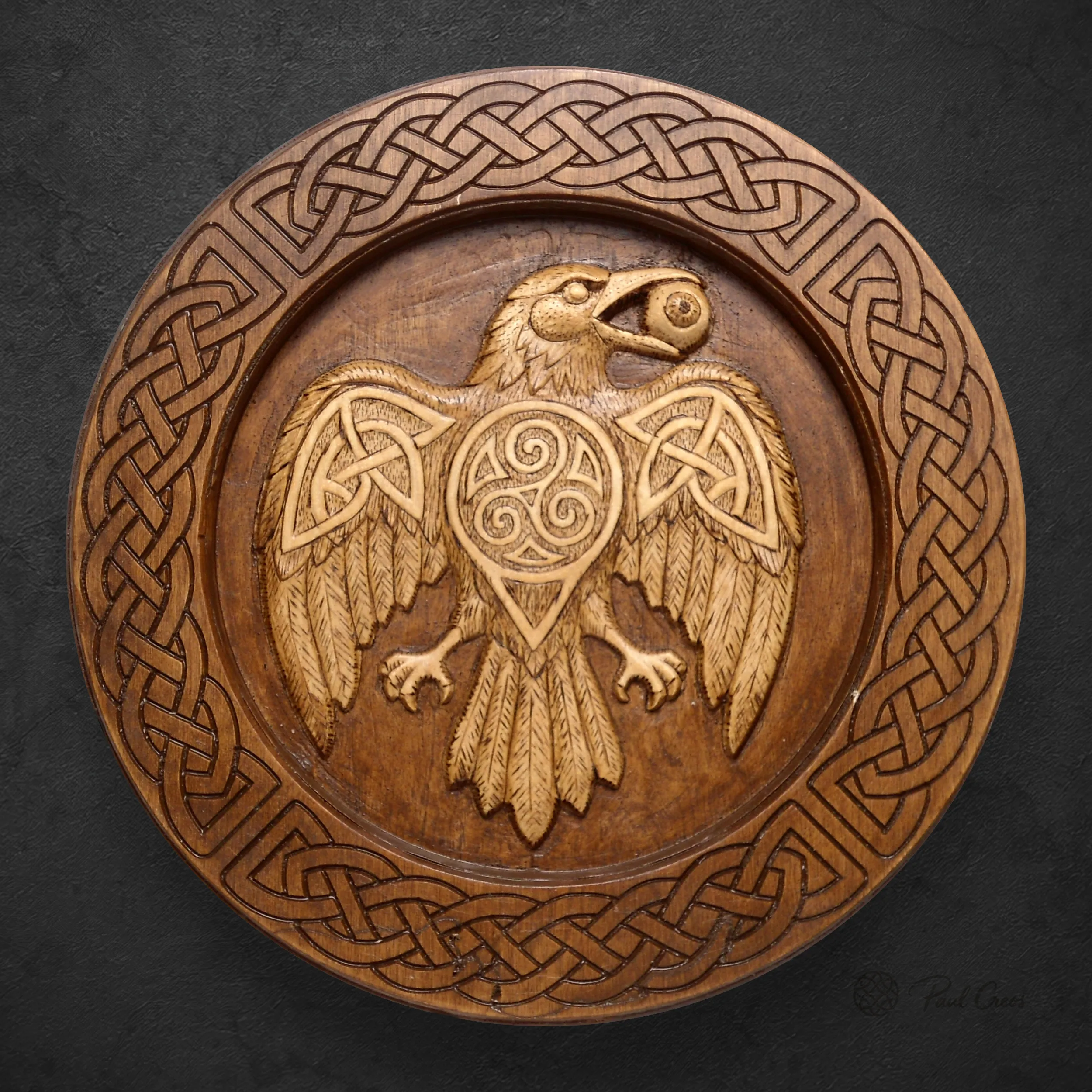 Raven Warden II thumbnail showing a carved raven and triskele within a Celtic knotwork border